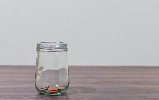 Save money and account banking for finance concept, Coins stack in bottle on blurred background