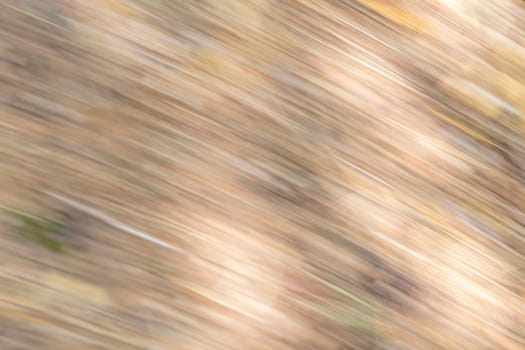 Background from beige stripes and blurred dark and light areas