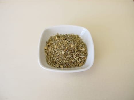 Dried absinthe wormwood herbs on a wooden board, Artemisia absinthium