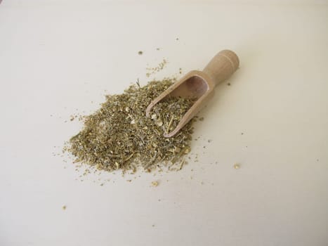 Dried absinthe wormwood herbs on a wooden board, Artemisia absinthium