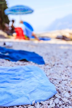 Bathing towel on the beach  other people in blurry background