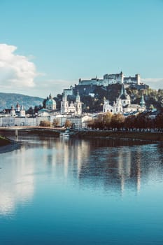 Salzburgs old city with fortress Hohensalzburg, blue sky