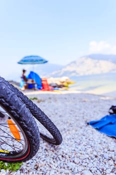 Mountain bike tyres on the beach, copy space