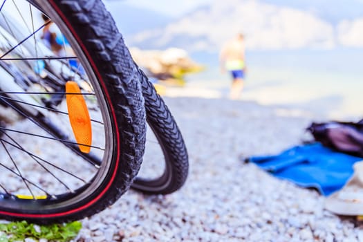Mountain bike tyres on the beach, copy space