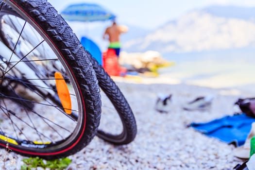 Mountain bike tyres on the beach, copy space