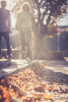 Young couple in autumn: Going for a walk, sunbeam