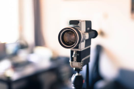 Vintage old movie camera indoor, copy space