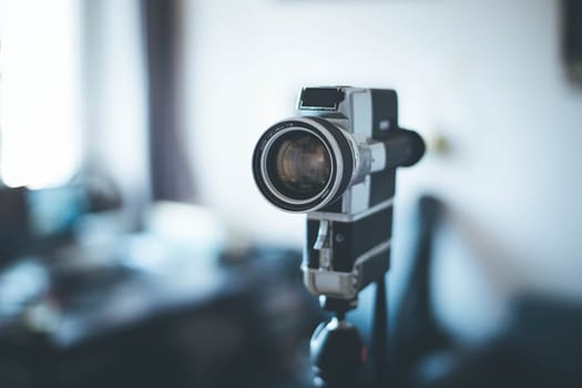 Vintage old movie camera indoor, copy space