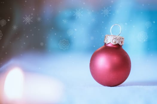 Christmas decoration: Close up of red Christmas baubles, advent calendar in the blurry background