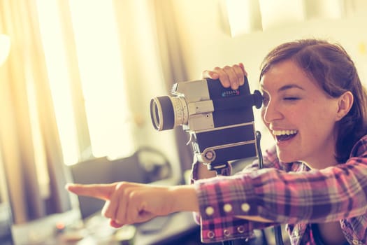 Filmmaker is doing a movie, vintage old movie camera
