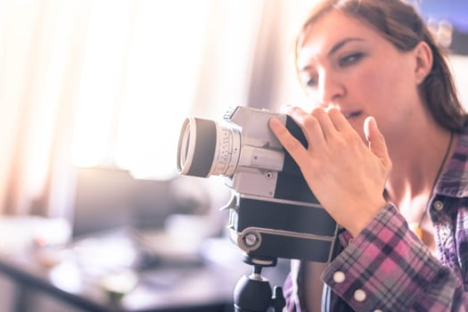 Filmmaker is doing a movie, vintage old movie camera