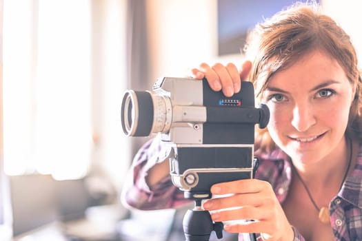 Filmmaker is doing a movie, vintage old movie camera