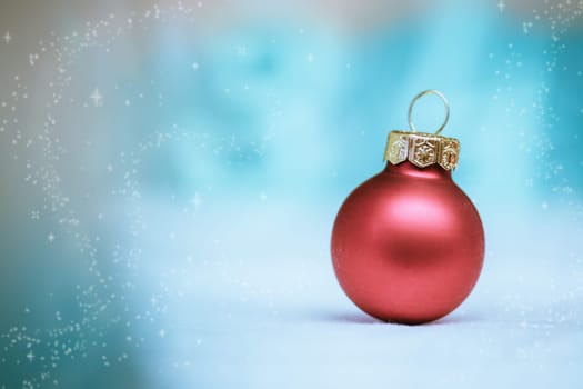 Christmas decoration: Close up of red Christmas baubles, advent calendar in the blurry background