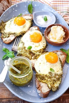 Pesto eggs, eggs, fried in basil pesto , sunny side up