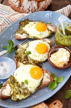 Pesto eggs, eggs, fried in basil pesto , sunny side up