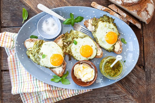 Pesto eggs, eggs, fried in basil pesto , sunny side up