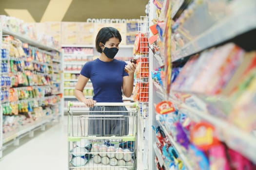 asia woman wearing mask shopping in mall department store