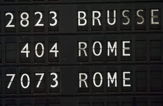 Flight information board in airport terminal