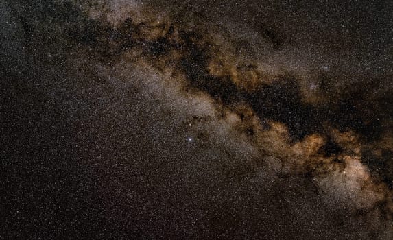Night sky, many stars with milky way around Aquila constellation visible. Long exposure stacked photo.