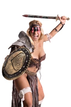 Ancient woman warrior or Gladiator posing with sword and shield, isolated in white