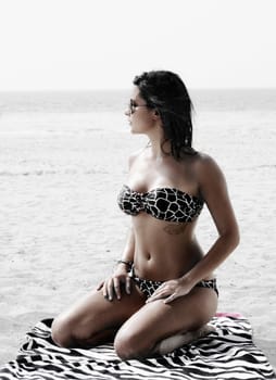 Fashion shot of beautiful woman on the beach in Dubai