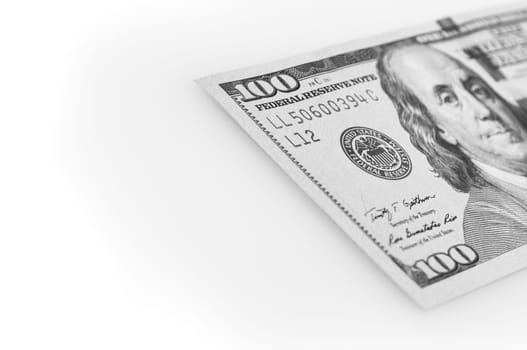 A hundred-dollar bill on a white background. The one hundred North American dollars bill is not fully positioned diagonally. Selective focus on a portion of the 100 bill. Black and white style. Place for logo, lettering, layout, layout.