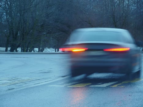 car blurred motion,red traffic lights