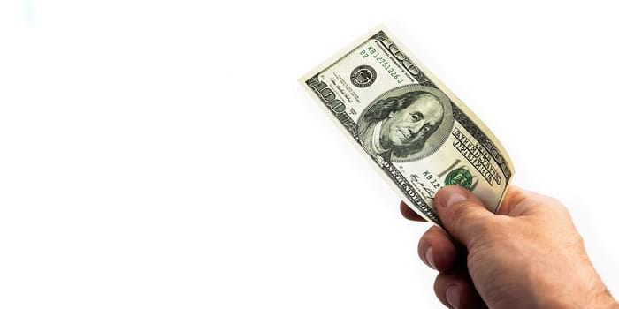 A hundred-dollar bill in his hand on a white background. Isolated. One hundred American dollars bill. One bill is dollars. The hand holds out the dollars. Place for logo, lettering, layout, layout.