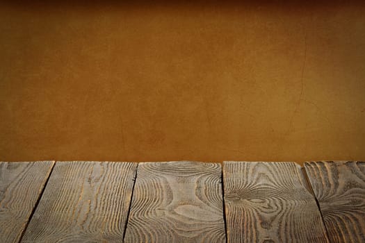 The background is blank wooden boards and a textured plastered wall with lighting and vignetting. For product demonstrations, free space, layout, mockup, perspective board, background board.