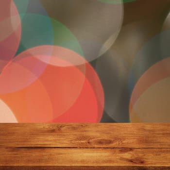 The background is an empty wooden board and a wall of blurred bokeh lights. For product demonstrations, free space, layout, mockup, perspective board, background board.