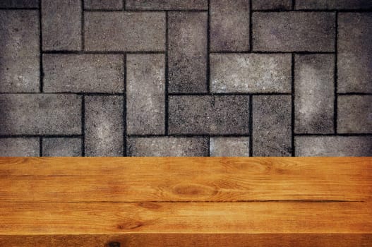The background is blank wooden boards and a textured brick wall with lighting and vignetting. For product demonstrations, free space, layout, mockup, perspective board, background board.