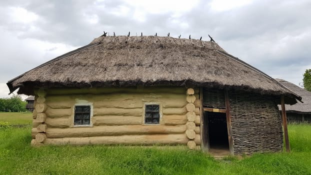 Ukraine, Kiev - June 11, 2020. The old house of peasants in the museum Pirogovo. National Museum of Folk Architecture and Everyday Life of Traditional Folklore Houses of Different Regions of Ukraine.