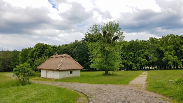 Ukraine, Kiev - June 11, 2020. The old house of peasants in the museum Pirogovo. National Museum of Folk Architecture and Everyday Life of Traditional Folklore Houses of Different Regions of Ukraine.