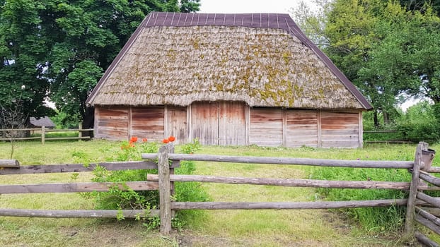 Ukraine, Kiev - June 11, 2020. The old house of peasants in the museum Pirogovo. National Museum of Folk Architecture and Everyday Life of Traditional Folklore Houses of Different Regions of Ukraine.
