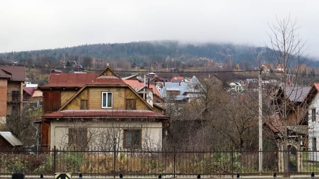A small town or village of Yaremche among the Carpathians on an autumn afternoon. Ukraine, Yaremche - November 20, 2019