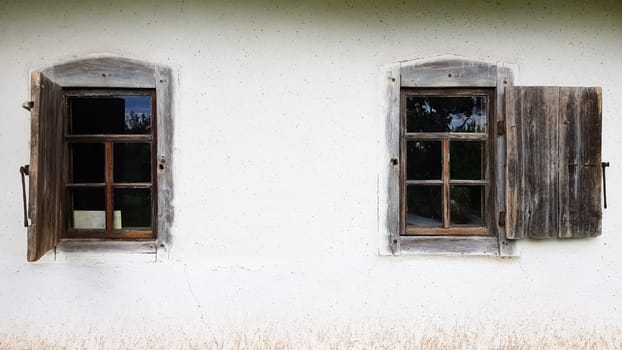 Ukraine, Kiev - June 11, 2020. Old window in a vintage traditional peasant house in Ukraine. Antique wooden window frame. Pirogovo National Museum in the open air in Kiev. Copy space