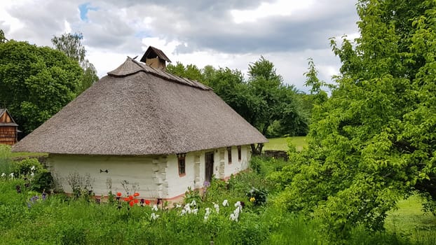 Ukraine, Kiev - June 11, 2020. The old house of peasants in the museum Pirogovo. National Museum of Folk Architecture and Everyday Life of Traditional Folklore Houses of Different Regions of Ukraine.