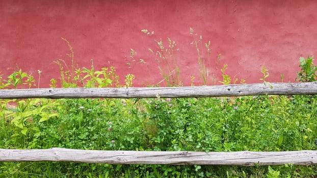 Texture of an old clay facade of a house painted in purple. Ukrainian old house