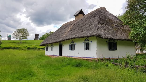 Ukraine, Kiev - June 11, 2020. The old house of peasants in the museum Pirogovo. National Museum of Folk Architecture and Everyday Life of Traditional Folklore Houses of Different Regions of Ukraine.