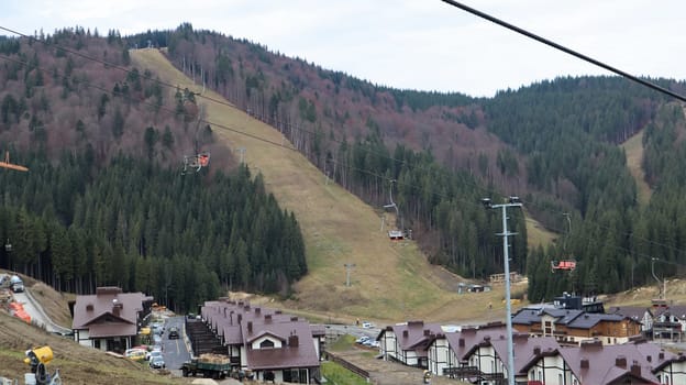 Bukovel ski resort in autumn aerial view. View of hotel houses in the ecological countryside against the background of spruce trees and mountain hills.Ukraine, Bukovel - November 20, 2019