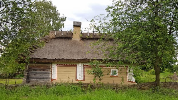 Ukraine, Kiev - June 11, 2020. The old house of peasants in the museum Pirogovo. National Museum of Folk Architecture and Everyday Life of Traditional Folklore Houses of Different Regions of Ukraine.