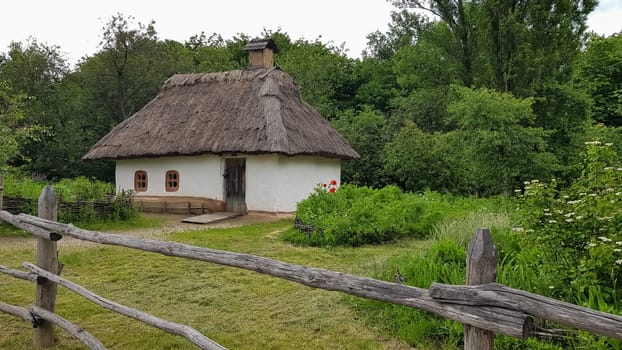 Ukraine, Kiev - June 11, 2020. The old house of peasants in the museum Pirogovo. National Museum of Folk Architecture and Everyday Life of Traditional Folklore Houses of Different Regions of Ukraine.