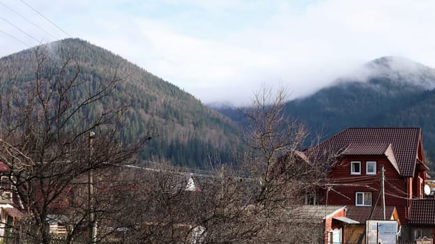A small town or village of Yaremche among the Carpathians on an autumn afternoon. Ukraine, Yaremche - November 20, 2019