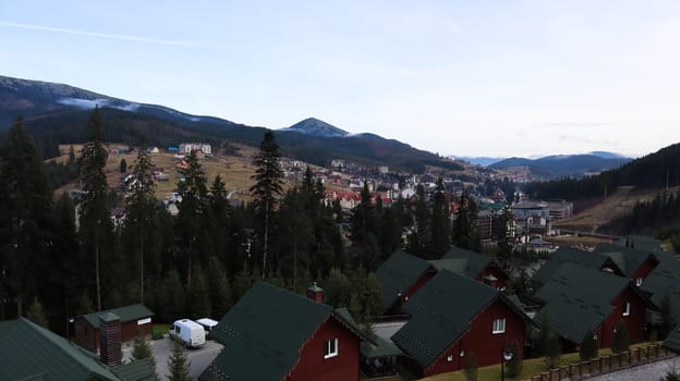 Bukovel ski resort in autumn aerial view. View of hotel houses in the ecological countryside against the background of spruce trees and mountain hills.Ukraine, Bukovel - November 20, 2019