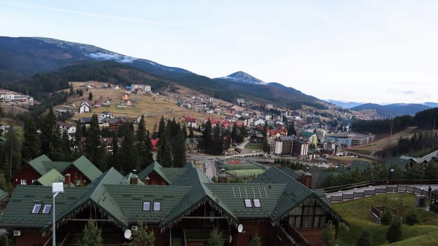 Bukovel ski resort in autumn aerial view. View of hotel houses in the ecological countryside against the background of spruce trees and mountain hills.Ukraine, Bukovel - November 20, 2019