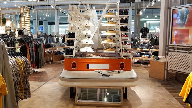 Ukraine, Kiev - September 04, 2019. Interior of a branded store of fashionable clothes and shoes.
