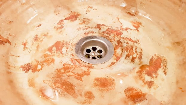 Vintage Beautiful faucet and golden mixer tap on a marble round sink in the bathroom. Interior of an expensive toilet with a marble sink.