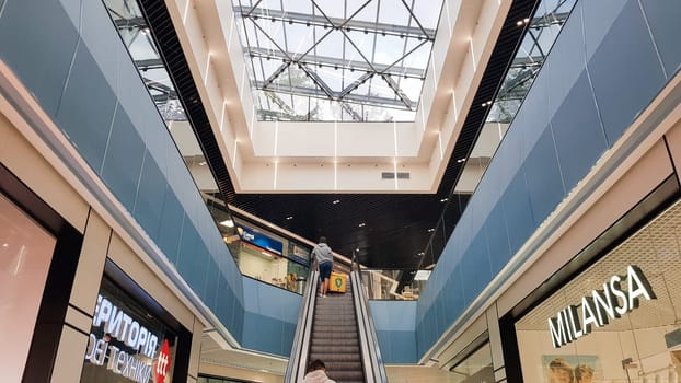 Ukraine, Kiev - September 24, 2019: Structural glazing of the facade. Abstract background with glass ceiling elements in a modern building. view of the blue sky through a glass window, separated by lattice elements