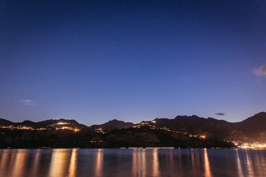 Beautiful night scenery at lago di garda. Lake, water and mountains.
