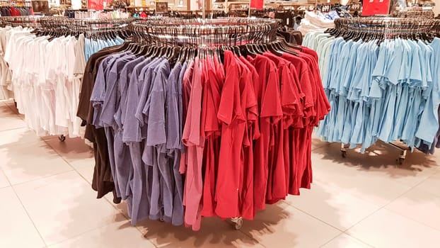 Ukraine, Kiev - September 04, 2019: A large clothing store, mannequins and many rows with hangers, a variety of sizes and colors. Black Friday, a day of shopping and sales at boutiques and malls.